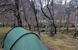 Our tent in a park by a glacial lake