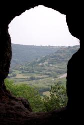 The hills framed by a cave