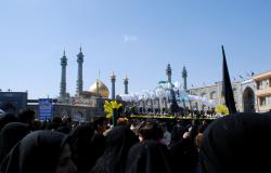 Crowds follow the procession towards the shrine