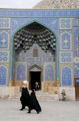 Women stroll by Sheikh Lotfollah Mosque
