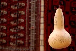 Carpets and a gourd decorated with Bukhara images