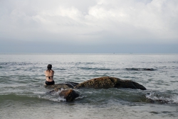 Sitting on a rock