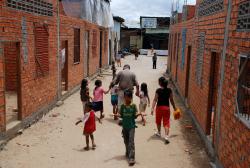 David walking with the kids towards the orphanage