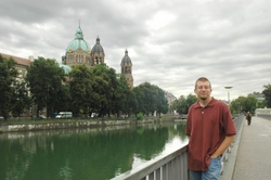 Andrew on a riverbank in Munich
