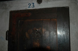 The door leading into one of the prison cells used to torture prisoners who had "misbehaved"