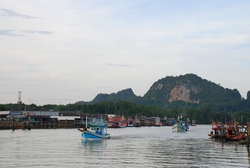 Fishing boats leaving Paknam Lang Suan