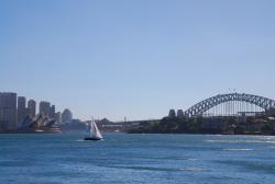 Sailboat going by the bridge