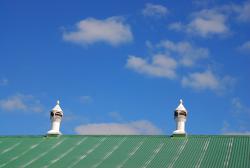 Air vents against a blue sky