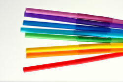 Eight drinking straws in rainbow colors