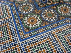 A mosaic design around a fountain