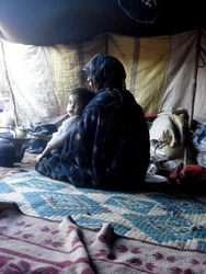 Inside a nomad tent at Chegaga, with baby Hassan