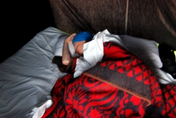 Andrew still asleep in our desert tent