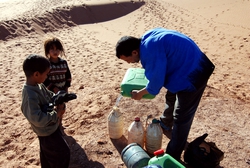 Giving the rest of our water to the Nomads