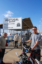 Locals check out our bikes, as we wait for the ferry