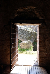 A doorway leading out towards the baths